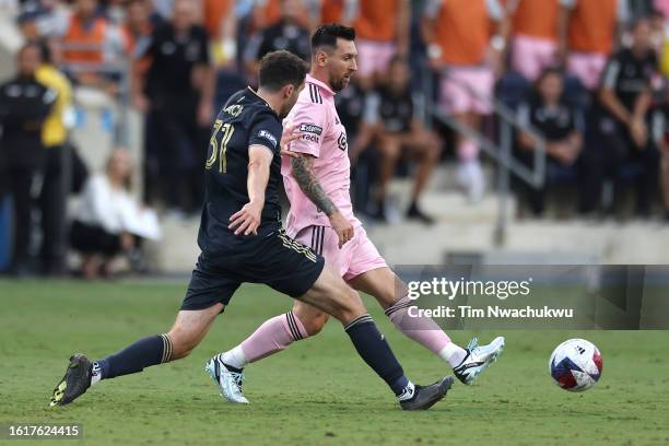 Lionel Messi of Inter Miami CF passes the ball ahead of Leon Flach of Philadelphia Union in the first half during the Leagues Cup 2023 semifinals...