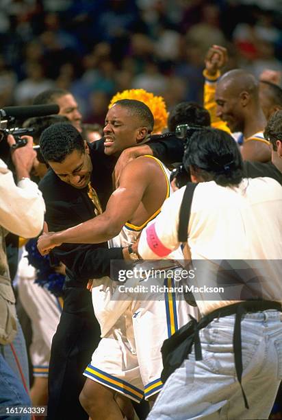 Playoffs: UCLA Tyus Edney victorious with teammates after hitting game-winning layup vs Missouri at Boise State Pavilion. Boise, ID 3/19/1995 CREDIT:...