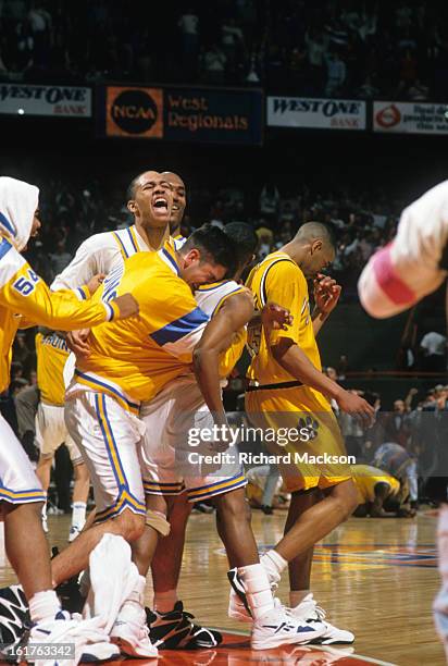 Playoffs: UCLA Tyus Edney victorious with teammates after hitting game-winning layup vs Missouri at Boise State Pavilion. Boise, ID 3/19/1995 CREDIT:...