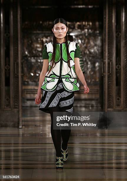 Model walks the runway at the Nova Chiu show during London Fashion Week Fall/Winter 2013/14 at Freemasons Hall on February 15, 2013 in London,...