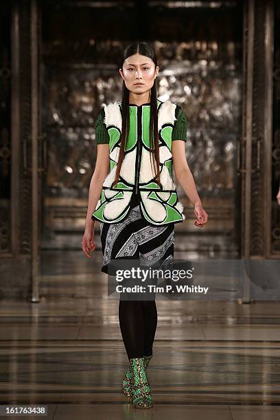 Model walks the runway at the Nova Chiu show during London Fashion Week Fall/Winter 2013/14 at Freemasons Hall on February 15, 2013 in London,...