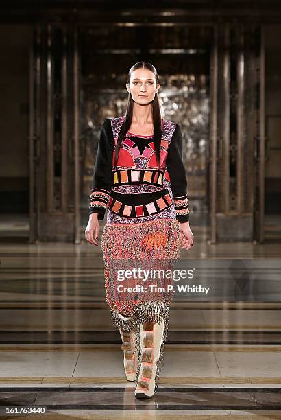 Model walks the runway at the Nova Chiu show during London Fashion Week Fall/Winter 2013/14 at Freemasons Hall on February 15, 2013 in London,...