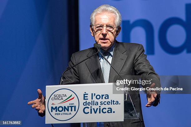 Outgoing Italian Prime Minister Mario Monti gestures as he delivers a speech during a campaign rally for his centrist alliance 'With Monit For Italy'...