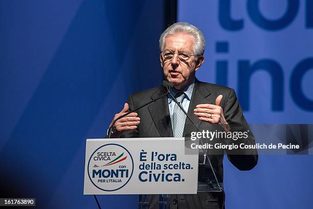 Outgoing Italian Prime Minister Mario Monti gestures as he delivers a speech during a campaign rally for his centrist alliance 'With Monit For Italy'...