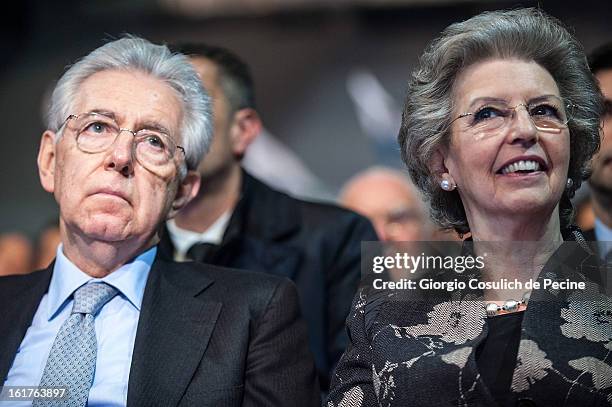 Outgoing Italian Prime Minister Mario Monti and his wife Elsa Antonioli attend a campaign rally for the centrist alliance 'With Monit For Italy' and...