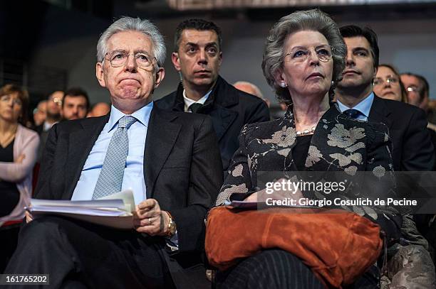 Outgoing Italian Prime Minister Mario Monti and his wife Elsa Antonioli attend a campaign rally for the centrist alliance 'With Monit For Italy' and...