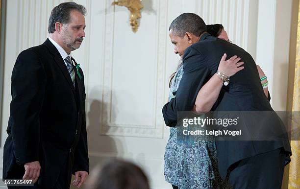 President Barack Obama presents Donna and Carlos Soto Sr. With the 2012 Presidential Citizens Medal on behalf of their daughter Victoria Soto at the...