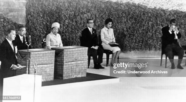 Prime Minister Eisaku Sato, far right, wipes his eyes as Vice-President Spiro Agnew reads the Presidential proclamation reverting Okinawa back to...