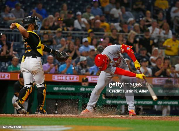 Willson Contreras of the St. Louis Cardinals draws the strike zone in the dirt after striking out in the seventh inning against the Pittsburgh...