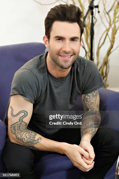 Singer Adam Levine poses after being interviewed by Danielle Monaro of "Elvis Duran and the Morning Show" at The Mercer Hotel on February 15, 2013 in...