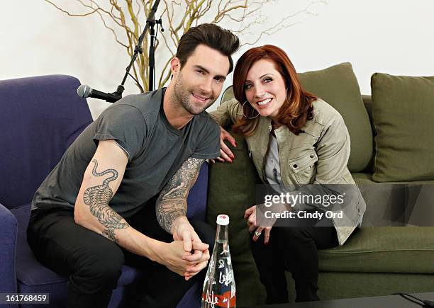 Singer Adam Levine poses with radio personality Danielle Monaro of "Elvis Duran and the Morning Show" at The Mercer Hotel on February 15, 2013 in New...