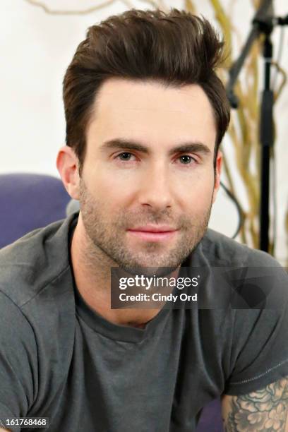 Singer Adam Levine poses after being interviewed by Danielle Monaro of "Elvis Duran and the Morning Show" at The Mercer Hotel on February 15, 2013 in...