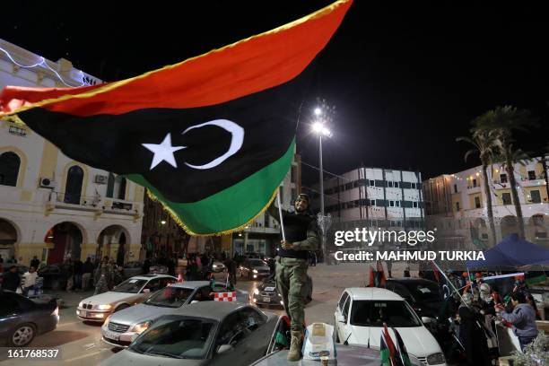 Libyans celebrate in Tripoli's landamark Martyrs square the upcoming second anniversary of the Libyan revolution on February 15, 2013. Libya on...