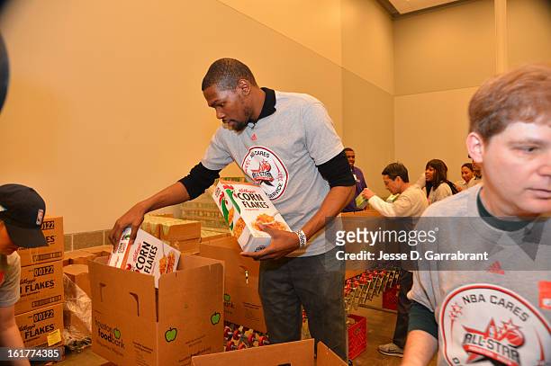 Kevin Durant of the Oklahoma City Thunder participates at the 2013 NBA Cares Day of Service at the Food Bank on February 15, 2013 in Houston, Texas....