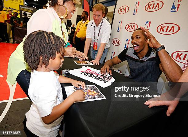 Dwight Howard signs autographs at the Kia MVP Court during the 2013 NBA Jam Session on February 14, 2013 at the George R. Brown Convention Center in...