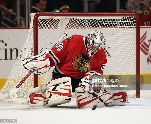 Ray Emery of the Chicago Blackhawks makes a save against the San Jose Sharks at the United Center on February 15, 2013 in Chicago, Illinois.