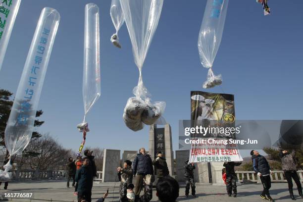 North Korean defectors, now living in South Korea, release balloons carrying propaganda leaflets denouncing North Korea's nuclear test at Imjingak,...
