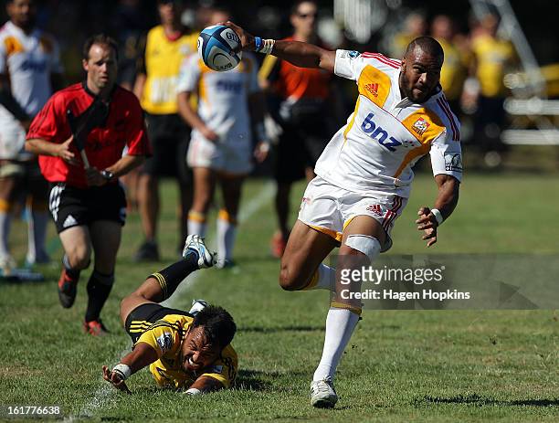 Patrick Osborne of the Chiefs makes a break during the Super Rugby trial match between the Hurricanes and the Chiefs at Mangatainoka RFC on February...