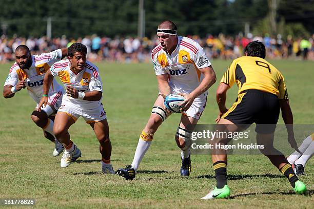 Brodie Retallick of the Chiefs looks to pass to Maritino Nemani during the Super Rugby trial match between the Hurricanes and the Chiefs at...