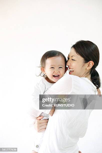 family(mama&baby) - mother holding baby white background stock pictures, royalty-free photos & images