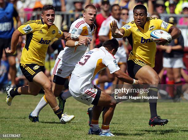 Julian Savea of the Hurricanes fends Tim Nanai-Williams of the Chiefs during the Super Rugby trial match between the Hurricanes and the Chiefs at...