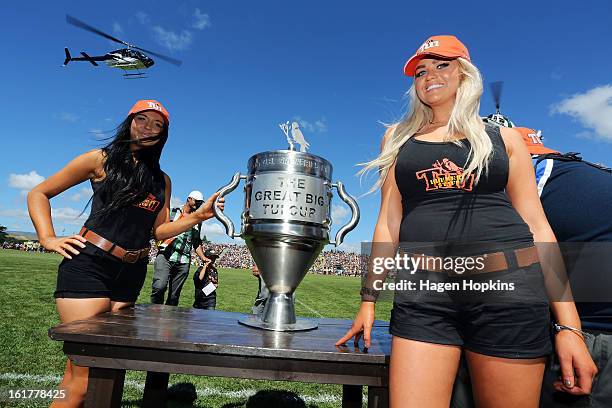 Tui girls pose with the Great Big Tui Cup during the Super Rugby trial match between the Hurricanes and the Chiefs at Mangatainoka RFC on February...