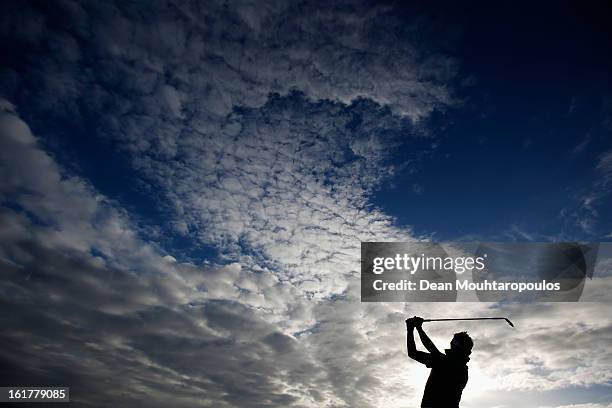 Jbe Kruger of South Africa hits practice balls on the driving range prior to Day Three of the Africa Open at East London Golf Club on February 16,...