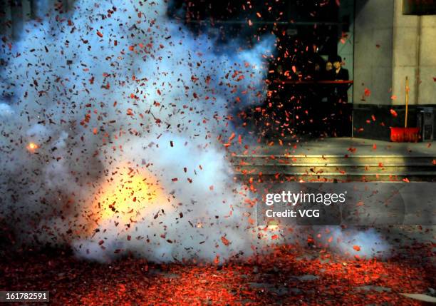 Fireworks explode for good fortune on February 16, 2013 in Dalian, Liaoning Province of China. Local businesses in China rushed to set off fireworks...