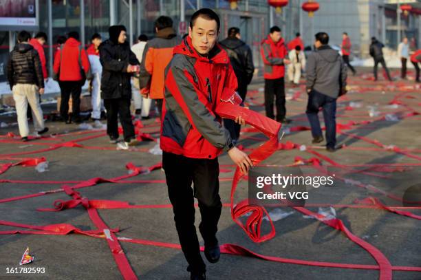 Fireworks are seen before lighting on a road on February 16, 2013 in Shenyang, Liaoning Province of China. Local businesses in China rushed to set...