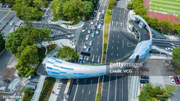 Aerial view of special-shaped Xinyue Pedestrian Bridge during its trial operation on August 10, 2023 in Hangzhou, Zhejiang Province of China.