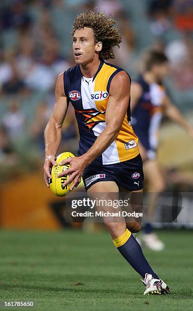 Matt Priddis of the West Coast Eagles runs with the ball during the round one NAB Cup match between the West Coast Eagles and the Fremantle Dockers...