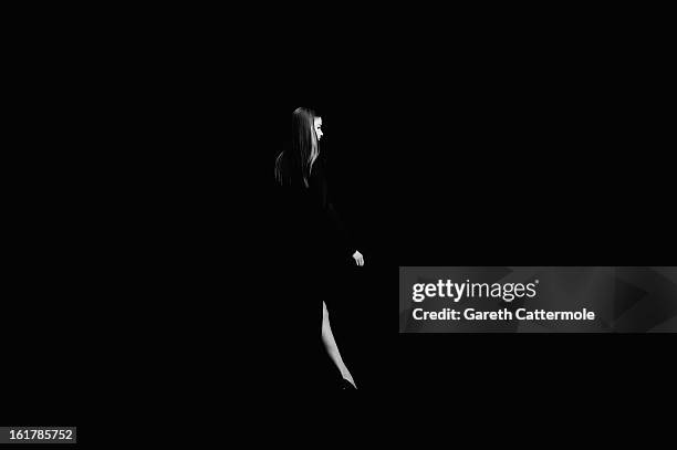 Model walks the runway during the DAKS show as part of London Fashion Week Fall/Winter 2013/14 at Somerset House on February 16, 2013 in London,...