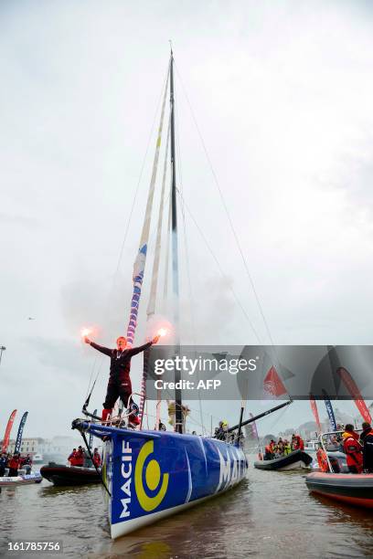 French skipper Francois Gabart celebrates on his boat after winning the 7th edition of the Vendee Globe solo round-the-world race on January 27, 2013...