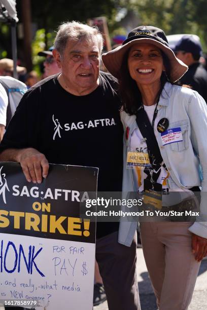 Dan Lauria and Michelle C. Bonilla walk the picket line in support of the SAG-AFTRA and WGA strike on August 22, 2023 at Disney Studios in Burbank,...