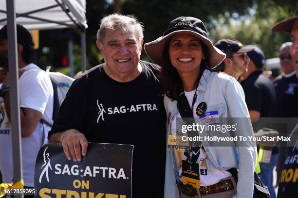 Dan Lauria and Michelle C. Bonilla walk the picket line in support of the SAG-AFTRA and WGA strike on August 22, 2023 at Disney Studios in Burbank,...