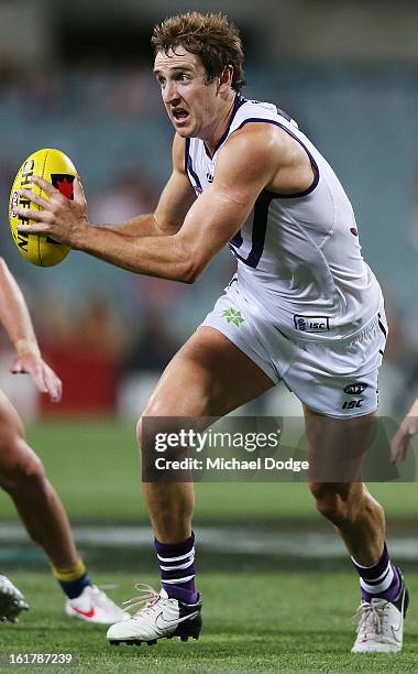 Michael Barlow of the Fremantle Dockers runs with the ball during the round one NAB Cup match between the West Coast Eagles and the Fremantle Dockers...