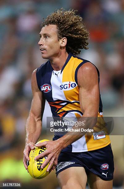 Matt Priddis of the West Coast Eagles runs with the ball during the round one NAB Cup match between the West Coast Eagles and the Fremantle Dockers...
