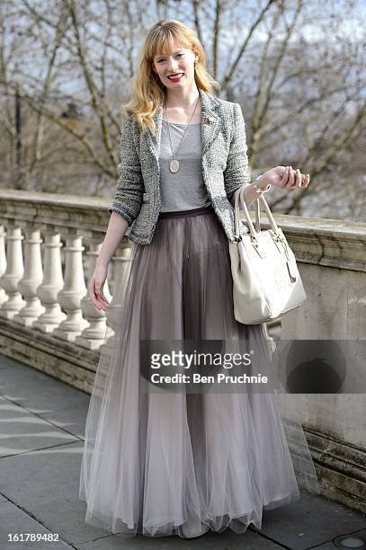 Online editor Lizzy poses wearing a Coast skirt, vintage jacket necklace and accessories with Gucci and a Bailey and Quinn bag at Somerset House...