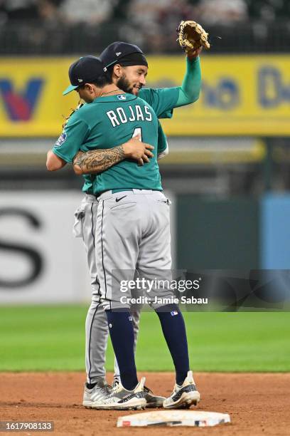 Crawford of the Seattle Mariners and Josh Rojas celebrate after defeating the Chicago White Sox 6-3 at Guaranteed Rate Field on August 22, 2023 in...