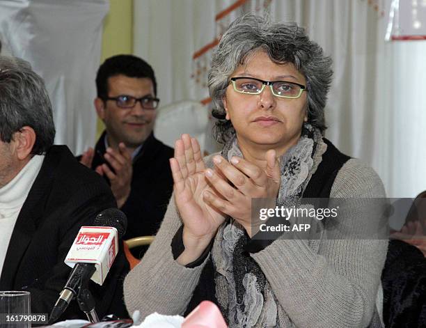 The widow of murdered opposition figure Chokri Belaid, Besma Khalfaoui applauds during a meeting with representatives of the Tunisia's leftist...