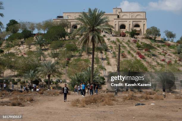 Iraqi people visit old looted Saddam Hussein's palace situated on top the hill on March 21, 2023 in Babylon, Iraq.