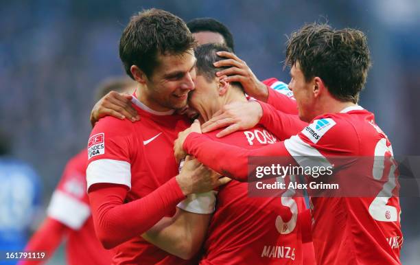 Zdenek Pospech of Mainz celebrates his team's second goal with team mates Andreas Ivanschitz and Nicolai Mueller during the Bundesliga match between...