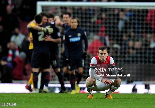 Dejected Jack Wilshere of Arsenal reacts following his team's 1-0 defeat during the FA Cup with Budweiser fifth round match between Arsenal and...