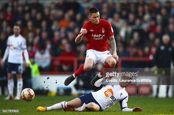 Henri Lansbury of Nottingham Forest battles with Jay Spearing of Bolton Wanderers during the npower Championship match between Nottingham Forest and...