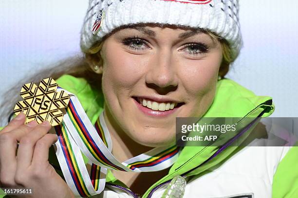 Mikaela Shiffrin of the US poses with her gold medal during the medal awards ceremony after the women's slalom at the 2013 Ski World Championships in...