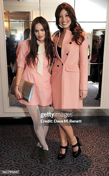 Atlanta de Cadenet and Daisy Lowe attend the Moschino cheap&chic show during London Fashion Week Fall/Winter 2013/14 at The Savoy Hotel on February...