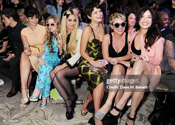 Oliver Cheshire, Gizzi Erskine, Anais Gallagher, Zara Martin, Pixie Geldof, Jaime Winstone and Daisy Lowe attend the Moschino cheap&chic show during...