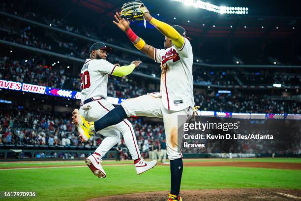 Marcell Ozuna of the Atlanta Braves and Ronald Acuna Jr. #13 celebrate the win over the New York Mets at Truist Park on August 22, 2023 in Atlanta,...