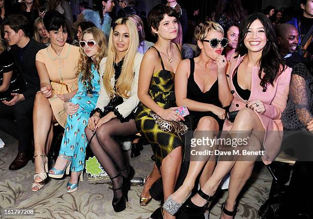 Oliver Cheshire, Gizzi Erskine, Anais Gallagher, Zara Martin, Pixie Geldof, Jaime Winstone and Daisy Lowe attend the Moschino cheap&chic show during...