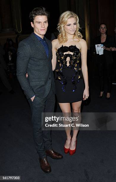 Oliver Cheshire and Pixie Lott attend the Julien Macdonald show during London Fashion Week Fall/Winter 2013/14 at Goldsmiths' Hall on February 16,...